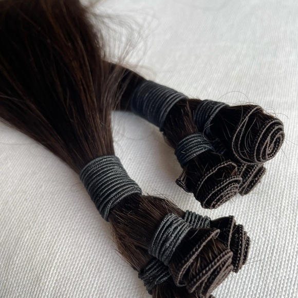 LUXE Russian Hand-Tied 100% human hair extensions.